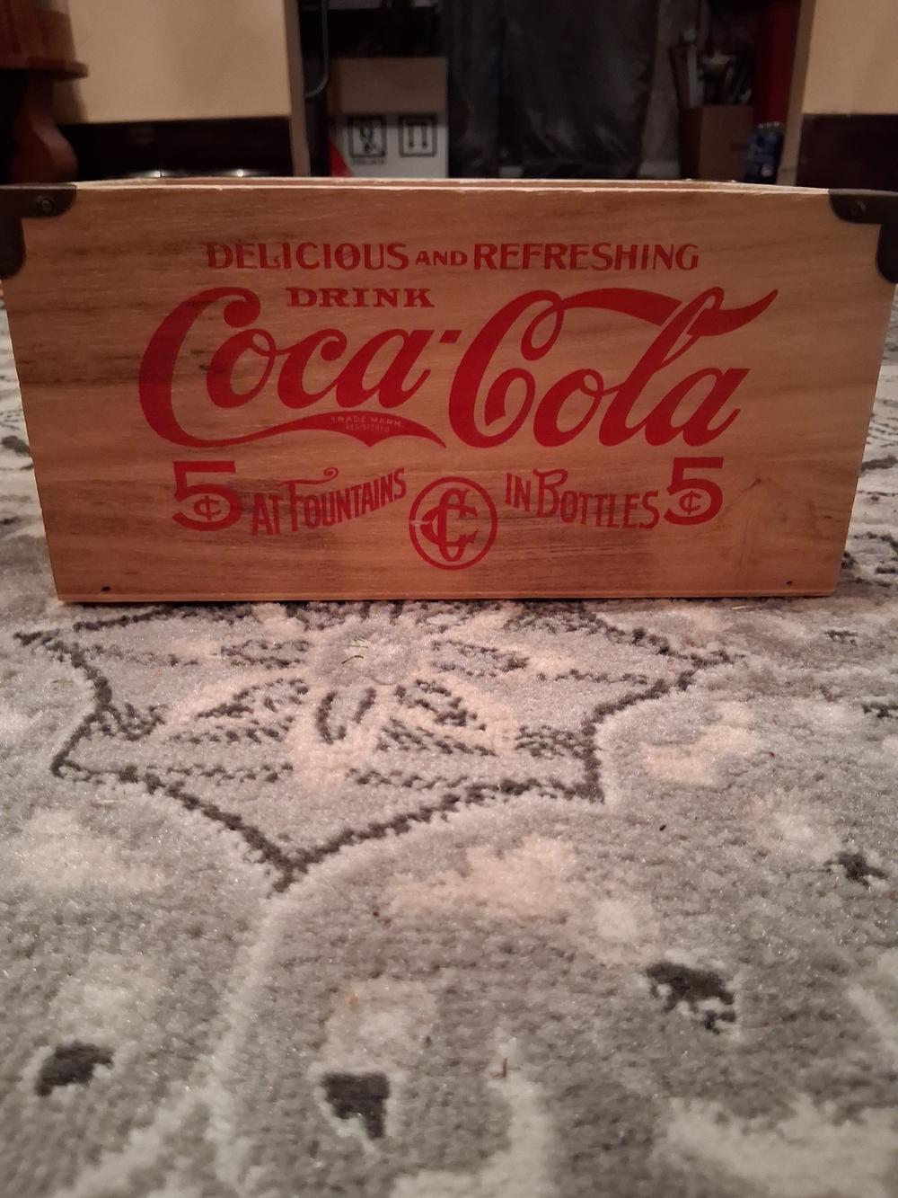 Coca-Cola Crate with Bold Red Logo on Wood